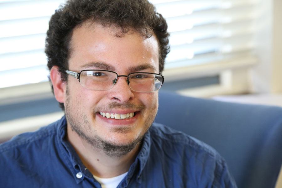 Photo of Jason Harris, a white male with glasses and brown hair, in front of a window